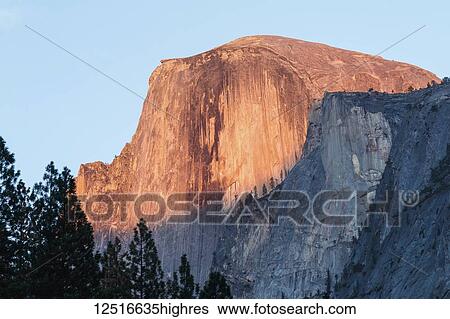 Stock Photograph - Half Dome sunset alpenglow, Yosemite National Park; California, United States of America. Fotosearch
