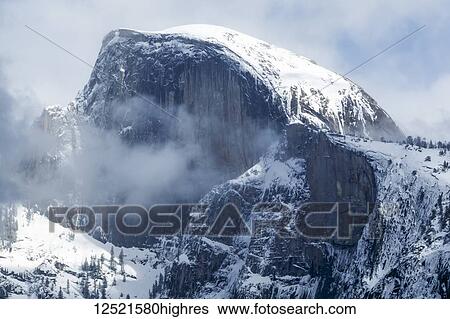 Stock Photograph - Half Dome with snow in winter, Yosemite Valley, Yosemite National Park; California, United States of America. Fotosearch