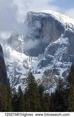 Stock Photograph - Half Dome with snow in winter, Yosemite Valley, Yosemite National Park; California, United States of America. Fotosearch