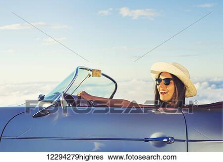 Happy Young Woman Driving In Classic Vintage Sports Car View Large Photo Image Stock Photograph - Happy Young Woman Driving In Classic Vintage Sports Car. Fotosearch
