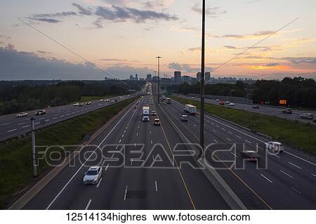 Highway 401 looking West towards Yonge Street at dusk; Toronto, Ontario, Canada View Large Photo Image Stock Photograph - Highway 401 looking West towards Yonge Street at dusk; Toronto, Ontario, Canada. Fotosearch