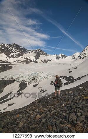 Hiker on Crow Pass Trail, in Chugach State Park near Girdwood, Southcentral Alaska, Summer. View Large Photo Image Stock Photo - Hiker on Crow Pass Trail, in Chugach State Park near Girdwood, Southcentral Alaska, Summer.. Fotosearch