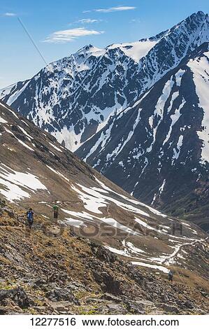 Hikers on Crow Pass Trail, in Chugach State Park near Girdwood, Southcentral Alaska, Summer. View Large Photo Image Stock Photograph - Hikers on Crow Pass Trail, in Chugach State Park near Girdwood, Southcentral Alaska, Summer.. Fotosearch
