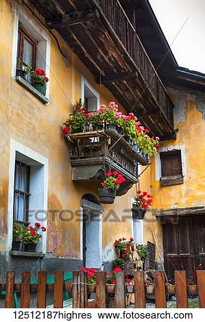 Historic building with flower pots, Dolonne, near Courmayeur; Aosta Valley, Italy View Large Photo Image Stock Photograph - Historic building with flower pots, Dolonne, near Courmayeur; Aosta Valley, Italy. Fotosearch
