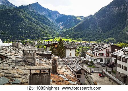 Historic stone roofs of buildings, viewed from city center of Courmayeur; Courmayeur, Aosta Valley, Italy View Large Photo Image Stock Photograph - Historic stone roofs of buildings, viewed from city center of Courmayeur; Courmayeur, Aosta Valley, Italy. Fotosearch