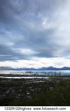Homer Spit, Kachemak Bay and the Kenai Mountains under a cloudy sky; Homer, Alaska, United States of America View Large Photo Image Stock Photograph - Homer Spit, Kachemak Bay and the Kenai Mountains under a cloudy sky; Homer, Alaska, United States of America. Fotosearch
