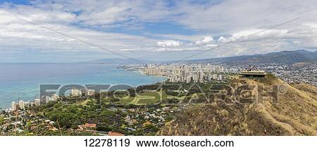 Honolulu Waikiki neighborhood with two young tourists on top of the World War II bunker in the foreground, photo taken from Diamond Head; Honolulu, Oahu, Hawaii, United States of America View Large Photo Image Stock Photo - Honolulu Waikiki neighborhood with two young tourists on top of the World War II bunker in the foreground, photo taken from Diamond Head; Honolulu, Oahu, Hawaii, United States of America. Fotosearch