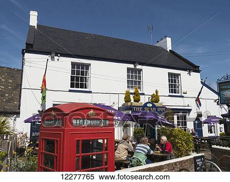 Stock Photography - Hotel and red telephone booth; Lympstone, Devon, England. Fotosearch