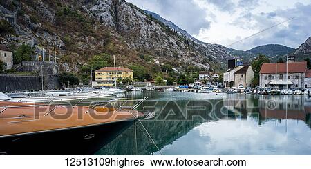 Stock Photograph - Houses and boats along the Bay of Kotor; Kotor, Monte. Fotosearch