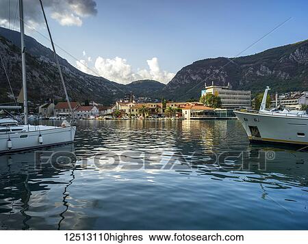 Stock Photograph - Houses and boats along the Bay of Kotor; Kotor, Monte. Fotosearch