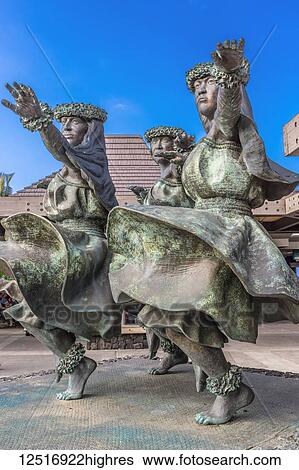 Stock Photograph - Hula Kahiko women dancer statues greet visitors at, Kona International Airport, Island of Hawaii, U. Fotosearch