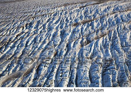 Stock Photograph - Ice and snow on the tidal flats, Kachemak Bay; Alaska, United States of America. Fotosearch