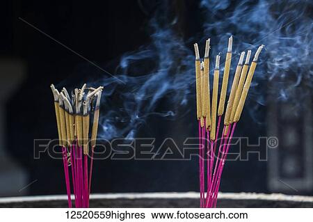 Stock Photograph - Incense burning at the Thien Mu Pagoda; Hue, Thua Thien-Hue, Vietnam. Fotosearch