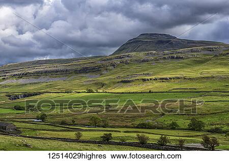 Ingleborough is the second-highest mountain in the Yorkshire Dales. It is one of the Yorkshire Three Peaks, the other two being Whernside and Pen-y-ghent; Yorkshire Dales, England View Large Photo Image Stock Photograph - Ingleborough is the second-highest mountain in the Yorkshire Dales. It is one of the Yorkshire Three Peaks, the other two being Whernside and Pen-y-ghent; Yorkshire Dales, England. Fotosearch
