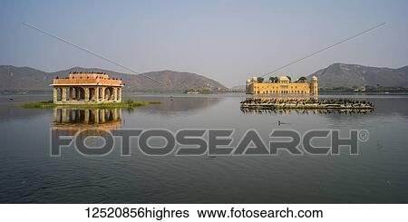 Jal Mahal Palace, made of red sandstone, sitting submerged in Man Sagar Lake; Jaipur, Rajasthan, India View Large Photo Image Stock Photograph - Jal Mahal Palace, made of red sandstone, sitting submerged in Man Sagar Lake; Jaipur, Rajasthan, India. Fotosearch