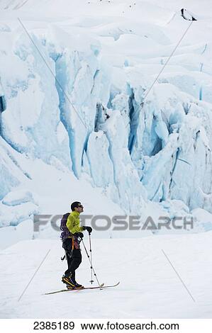 Jeff Benowitz skiing in front of Portage Glacier, Southcentral Alaska, Winter View Large Photo Image Stock Photo - Jeff Benowitz skiing in front of Portage Glacier, Southcentral Alaska, Winter. Fotosearch