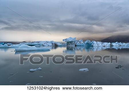 Stock Photograph - Jokulsarlon, a large lagoon filled with icebergs along the Southern coast of Iceland; Iceland. Fotosearch