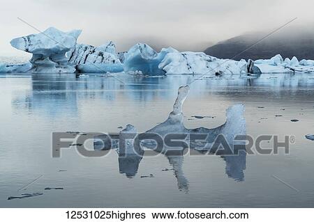 Jokulsarlon, a large lagoon filled with icebergs along the Southern coast of Iceland; Iceland View Large Photo Image Stock Photograph - Jokulsarlon, a large lagoon filled with icebergs along the Southern coast of Iceland; Iceland. Fotosearch