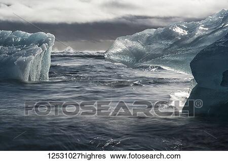 Stock Photograph - Jokulsarlon, a large lagoon filled with icebergs along the Southern coast of Iceland; Iceland. Fotosearch