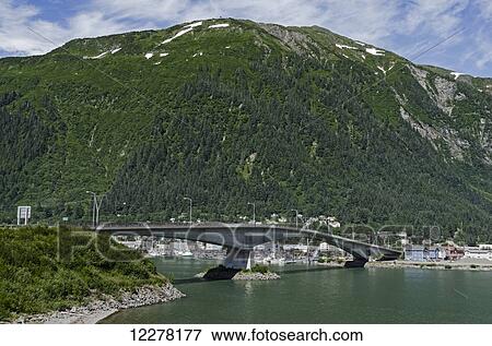 Stock Photo - Juneau-Douglas Bridge connects Douglas Island with Juneau, Southeast Alaska, summer. Fotosearch