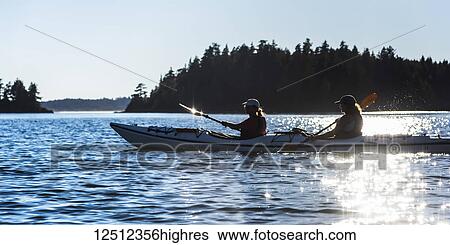 Stock Photograph - Kayaking in Clayoquot Sound, Vancouver Island; Tofino, British Columbia, Canada. Fotosearch