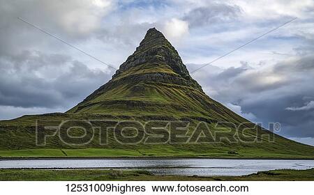 Stock Photograph - Kirkjufell, the most photographed mountain in Iceland, near Grundarfjodur, Snaefellsness Peninsula; Iceland. Fotosearch