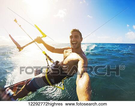 Stock Photograph - Kiteboarding. Fun In The Ocean, Extreme Sport Kitesurfing. Pov Angle With Action Camera. Fotosearch