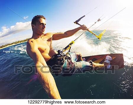 Stock Photograph - Kiteboarding. Fun In The Ocean, Extreme Sport Kitesurfing. Pov Angle With Action Camera. Fotosearch