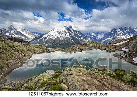 Lac Blanc reflects the sky, with Mont Blanc Massif and Refuge du Lac Blanc in the background; Chamonix-Mont-Blanc, Haute-Savoie, France View Large Photo Image Stock Photograph - Lac Blanc reflects the sky, with Mont Blanc Massif and Refuge du Lac Blanc in the background; Chamonix-Mont-Blanc, Haute-Savoie, France. Fotosearch