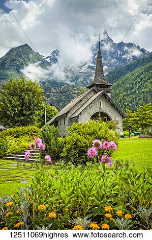 Les Praz de Chamonix medieval church and flower garden with Aiguille Dru mountain in the background; Chamonix-Mont-Blanc, Haute-Savoie, France View Large Photo Image Stock Photograph - Les Praz de Chamonix medieval church and flower garden with Aiguille Dru mountain in the background; Chamonix-Mont-Blanc, Haute-Savoie, France. Fotosearch