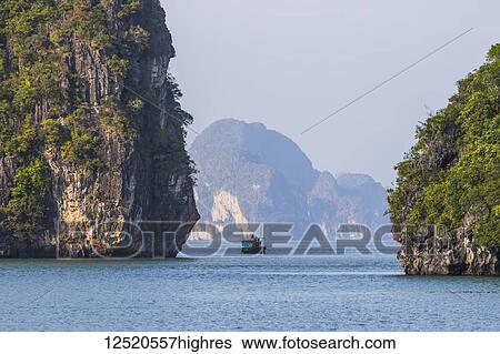 Stock Photograph - Limestone karsts and isles of Ha Long Bay; Quang Ninh, Vietnam. Fotosearch