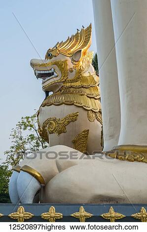 Stock Photograph - Lion sculptures at a temple; Yangun, Myanmar. Fotosearch