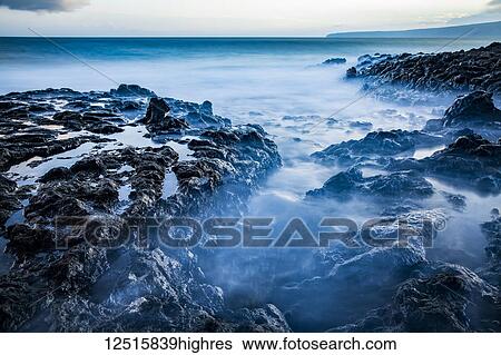 Long exposure of tide pools along the coastline and a view of the Pacific Ocean; Makawao, Maui, Hawaii, United States of America View Large Photo Image Stock Photograph - Long exposure of tide pools along the coastline and a view of the Pacific Ocean; Makawao, Maui, Hawaii, United States of America. Fotosearch