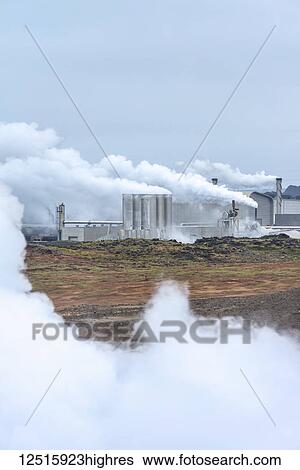 Stock Photograph - Looking across steamy, lunar landscape towards Reykjanes Power Plant; Iceland. Fotosearch