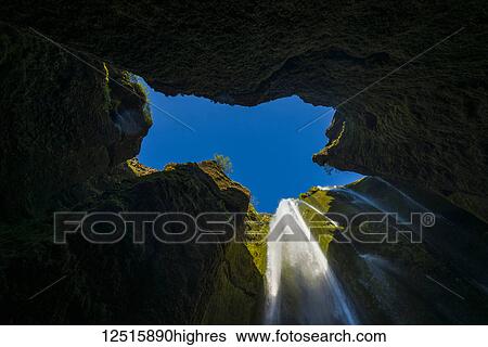 Looking up to a small waterfall in large hole near Seljalandsfoss; Iceland View Large Photo Image Stock Photograph - Looking up to a small waterfall in large hole near Seljalandsfoss; Iceland. Fotosearch