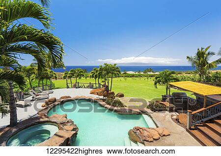 Stock Photograph - Luxury Home With Swimming Pool. Fotosearch