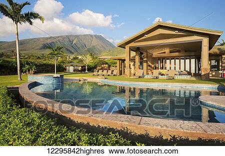 Stock Photograph - Luxury Home With Swimming Pool. Fotosearch