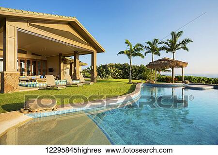 Stock Photograph - Luxury Home With Swimming Pool. Fotosearch