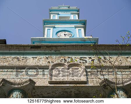 Magen David Synagogue. Built in 1864, this sizable Jewish Synagogue features two schools open to children of all faiths; Mumbai, Maharashtra, India View Large Photo Image Stock Photograph - Magen David Synagogue. Built in 1864, this sizable Jewish Synagogue features two schools open to children of all faiths; Mumbai, Maharashtra, India. Fotosearch