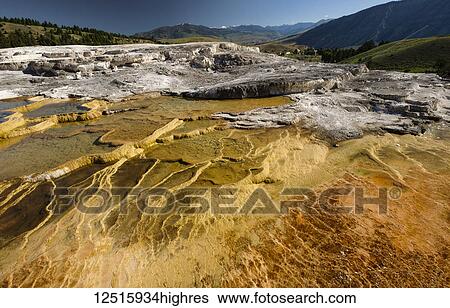 Stock Photograph - Mammoth Springs, a hot mineral springs, Yellowstone National Park, Wyoming, United States of America. Fotosearch