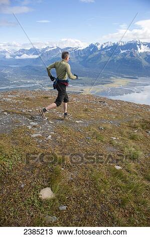 Man descending the upper scree fields of Mount Marathon, Seward, Southcentral, Alaska, summer View Large Photo Image Stock Image - Man descending the upper scree fields of Mount Marathon, Seward, Southcentral, Alaska, summer. Fotosearch