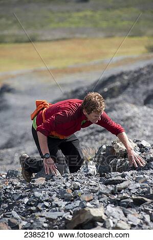 Man hiking the steep shale cliffs above treeline on the Mount Marathon trail, Seward, Seward, Summer, Southcentral Alaska View Large Photo Image Stock Image - Man hiking the steep shale cliffs above treeline on the Mount Marathon trail, Seward, Seward, Summer, Southcentral Alaska. Fotosearch