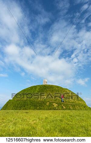 Man walking up Thufa grassy dome with fish drying house on top (art installation by Olof Nordal); Reykjavik, Iceland View Large Photo Image Stock Photograph - Man walking up Thufa grassy dome with fish drying house on top (art installation by Olof Nordal); Reykjavik, Iceland. Fotosearch