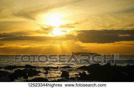 Stock Photograph - Maui sunset, Kahoolawe in distance, Wailea, Maui, Hawaii, United States of America. Fotosearch
