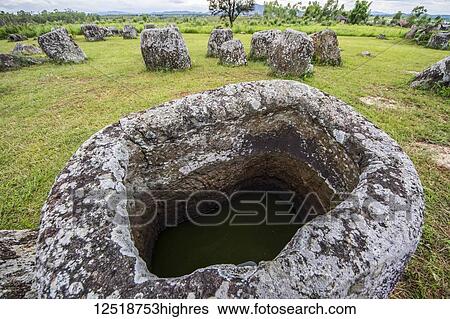 Stock Photograph - Megalithic stone jars at Site 1, Plain of Jars; Xiangkhouang, Laos. Fotosearch