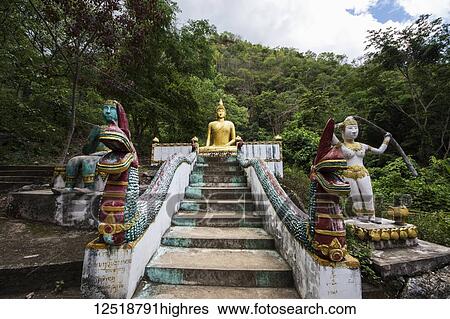 Stock Photograph - Memorial stupa by Tham Piu Cave, place where on 24 November 1969, a single rocket fired from a US aircraft killed an estimated 374 people who had taken refuge in the cave; Xiangkhouang, Laos. Fotosearch