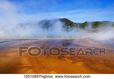 Stock Photograph - Midway Geyser Basin with the Grand Prismatic Spring, Yellowstone National Park; Wyoming, United States of America. Fotosearch