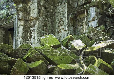 Moss growing on fallen stone with bas-reliefs of Apsaras on a temple door in the ruins of the Khmer temple of Beng Meala; Siem Reap, Cambodia View Large Photo Image Stock Photograph - Moss growing on fallen stone with bas-reliefs of Apsaras on a temple door in the ruins of the Khmer temple of Beng Meala; Siem Reap, Cambodia. Fotosearch