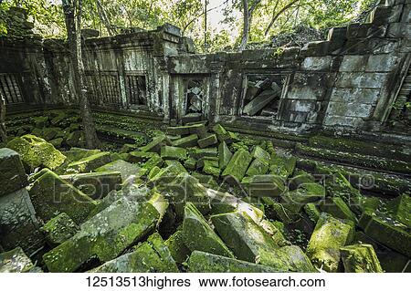 Stock Photograph - Moss growing on fallen stones in the ruins of the Khmer temple of Beng Meala; Siem Reap, Cambodia. Fotosearch