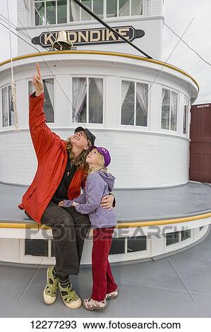 Mother and daughter sit outside on the deck of the SS Klondike, Whitehorse, Yukon Territory, Canada, Summer View Large Photo Image Stock Image - Mother and daughter sit outside on the deck of the SS Klondike, Whitehorse, Yukon Territory, Canada, Summer. Fotosearch